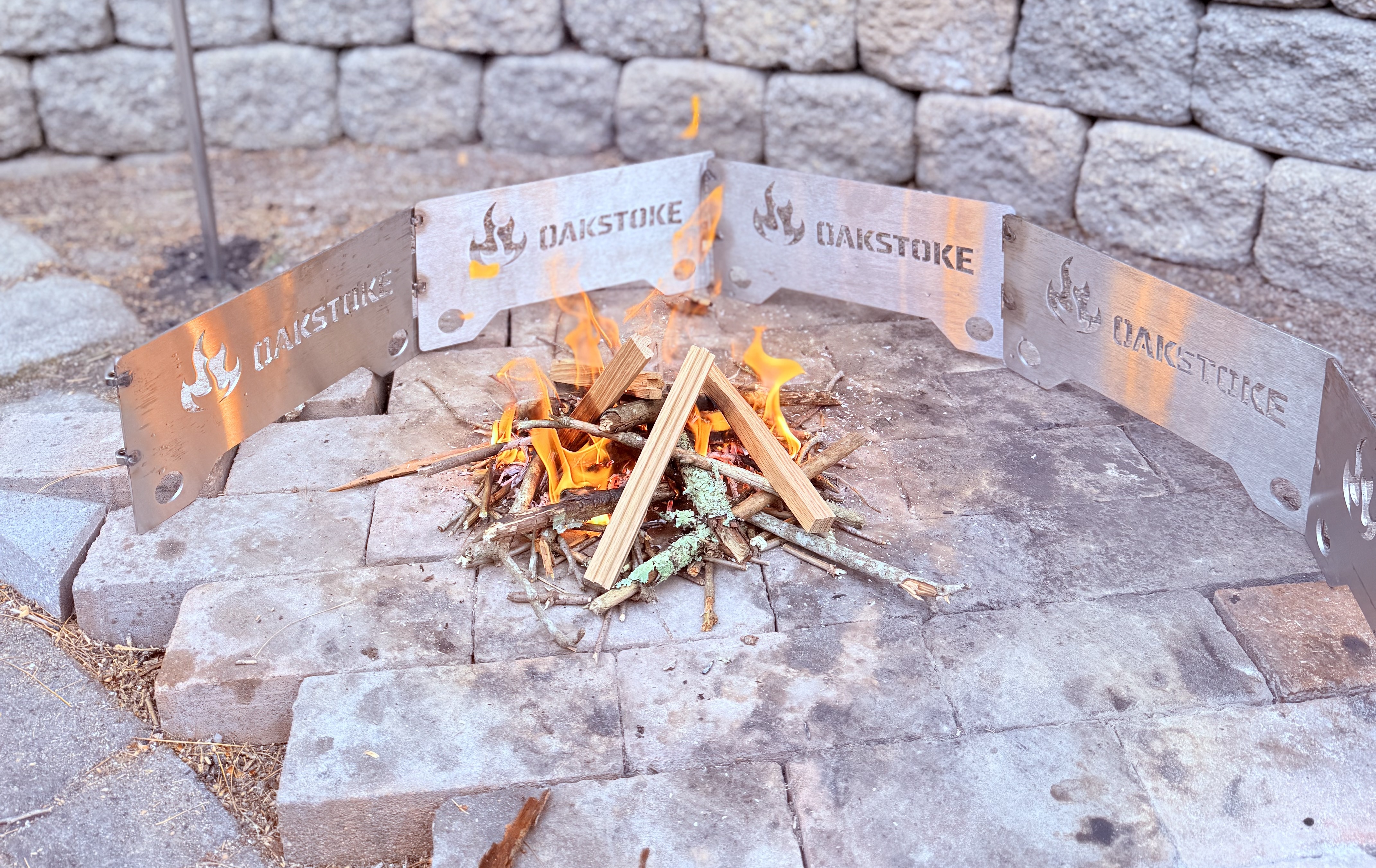 OakStoke Fire Ring Plates assembled with campfire burning inside