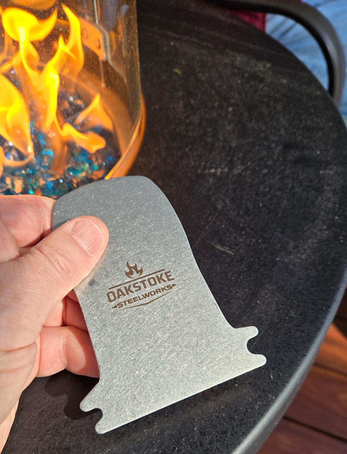 OakStoke bristle-free 304 stainless steel grill scraper held by fire